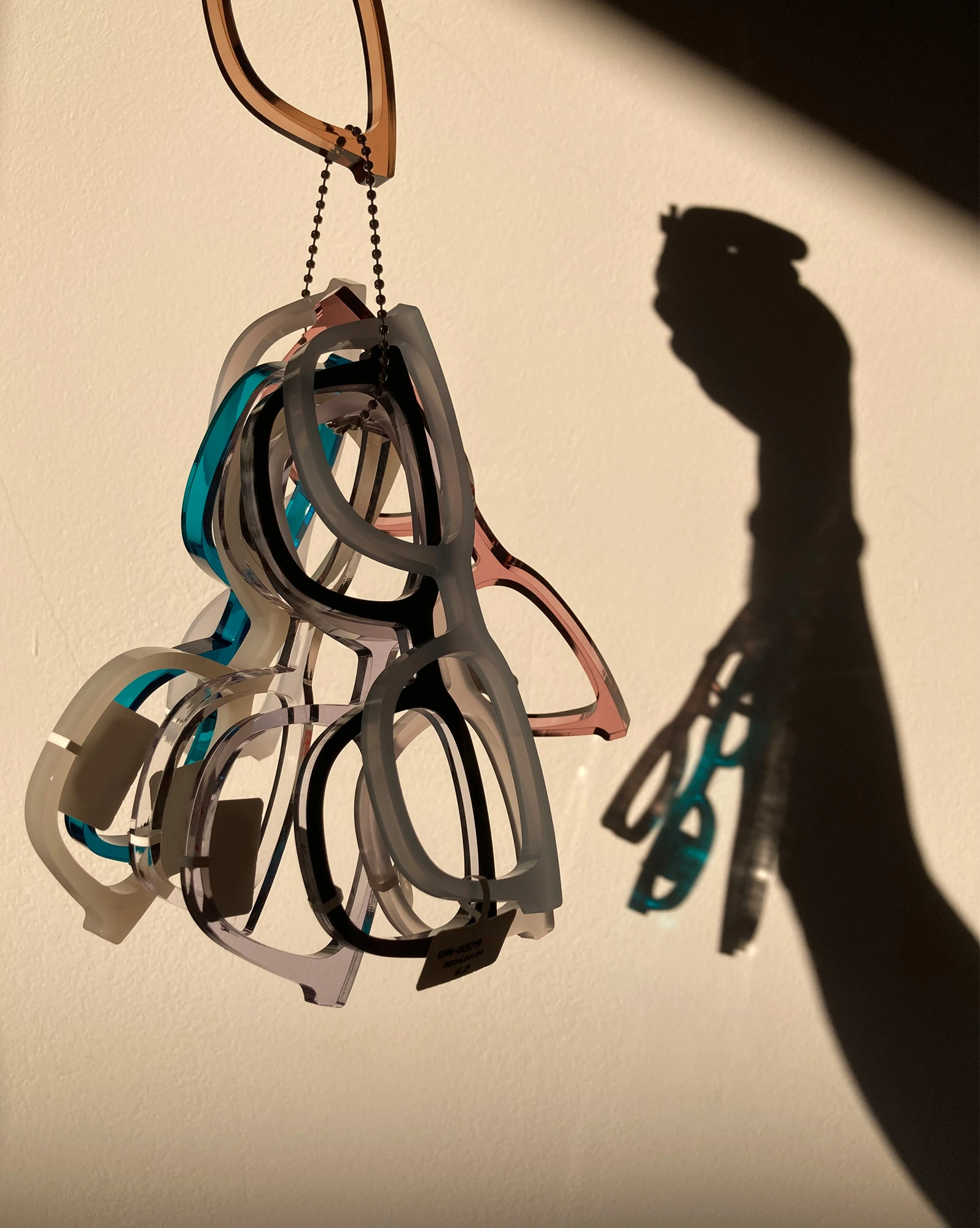 Acetate frame colour samples hanging in warm sunlight