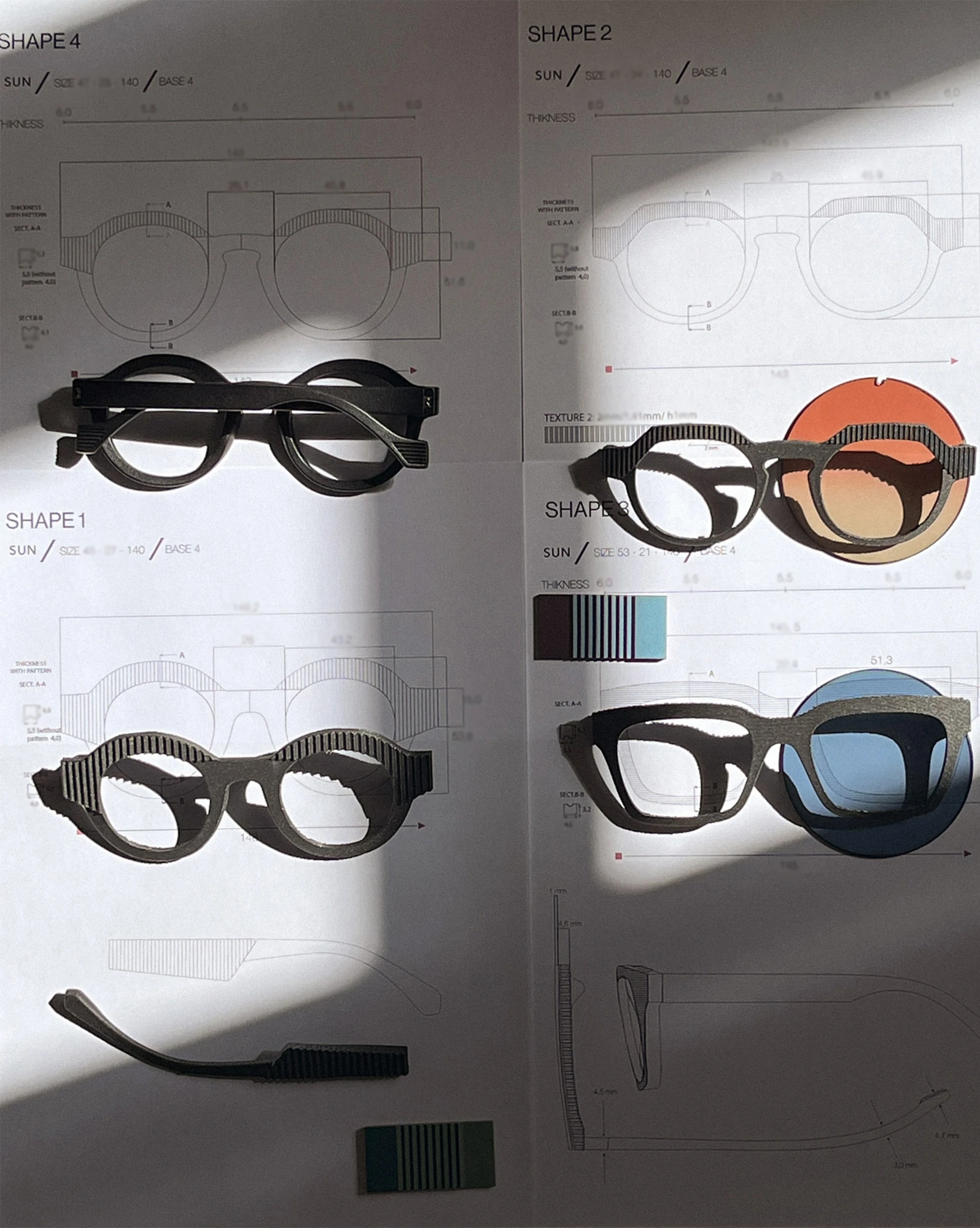 CÉHO studio eyewear prototypes on technical design drawings
