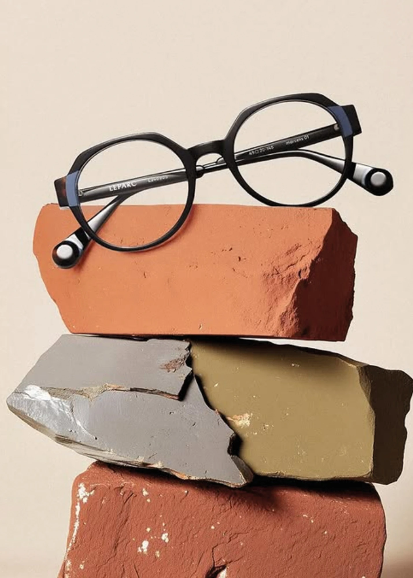 Black LEPARC optical frame resting on coloured bricks