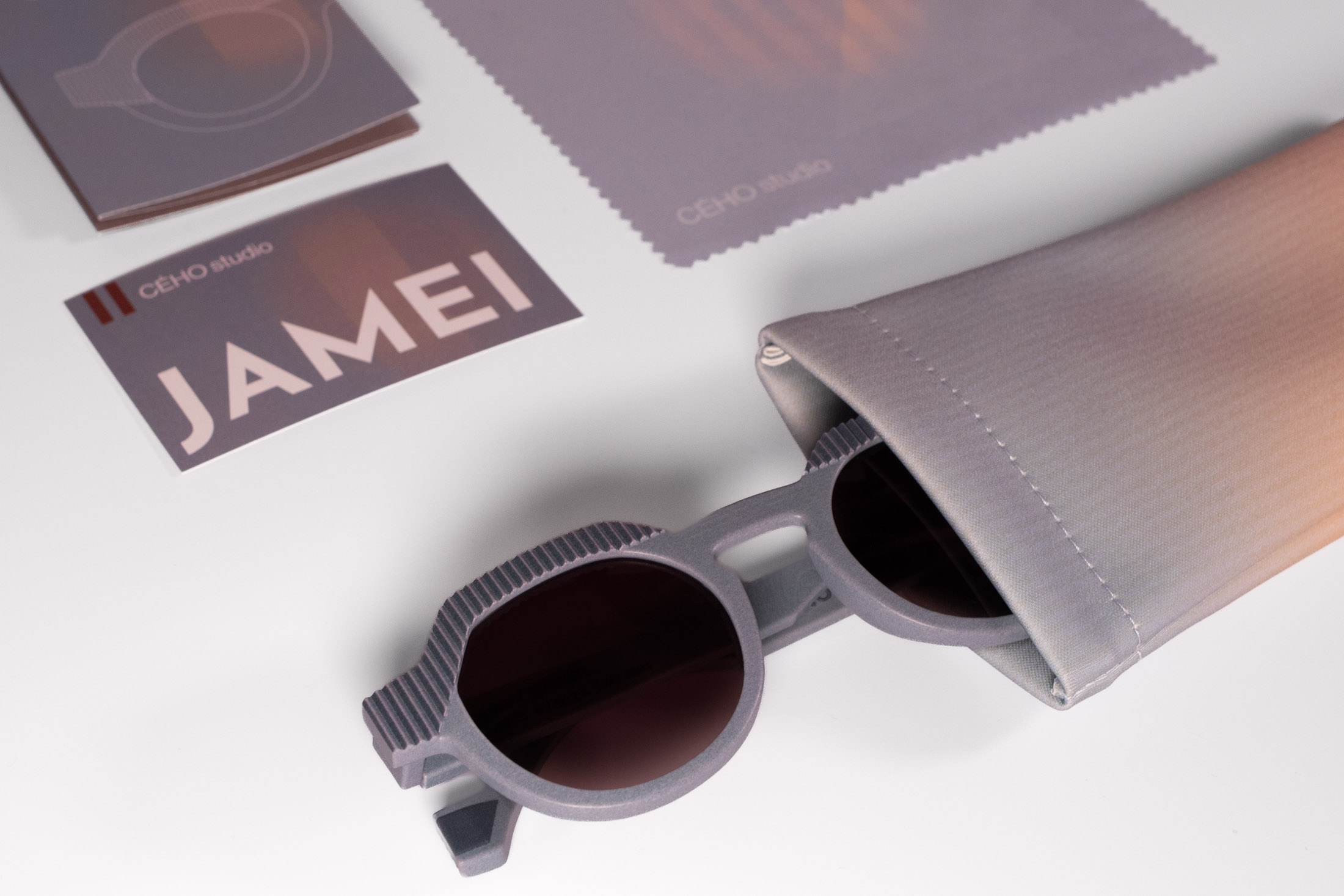 CÉHO studio packaging with JAMEI sunglasses, cleaning cloth, pouch and card