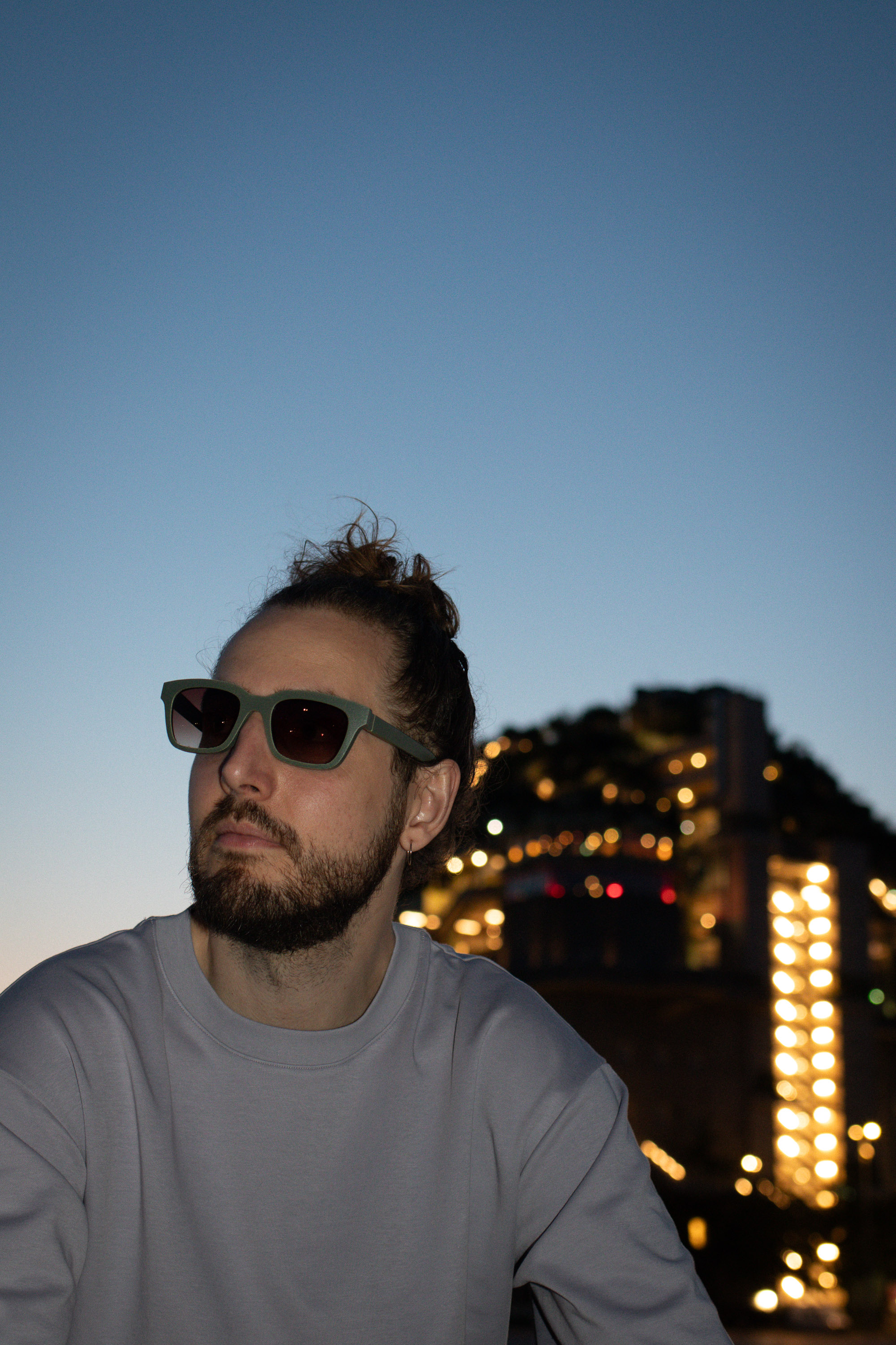 Kjell wearing CÉHO studio HOY olive and heather sunglasses