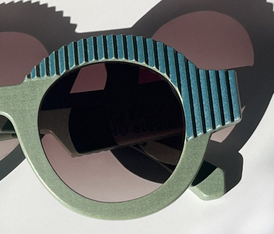 Close-up of the layered surface on a multi-color 3D printed CÉHO studio frame